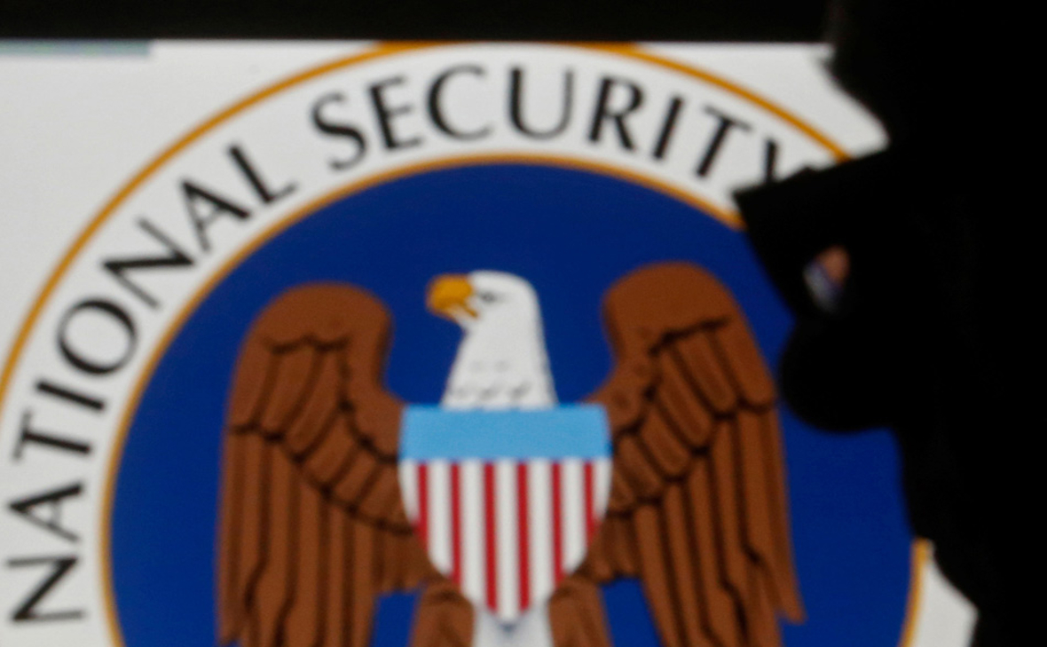 A man is silhouetted near logo of the U.S. National Security Agency (NSA). Dado Ruvic, Reuters/File Photo